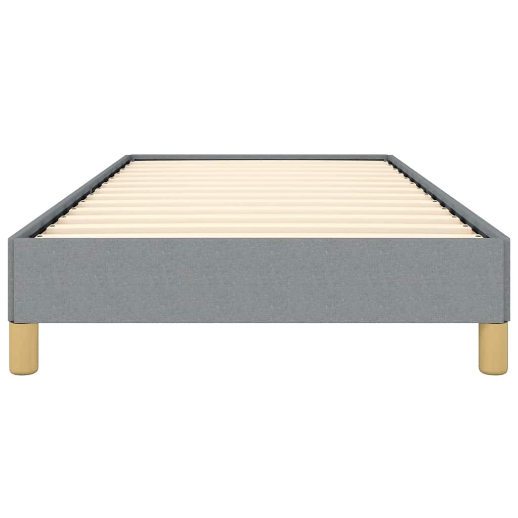 Gray upholstered bed frame with wooden slats and gold legs