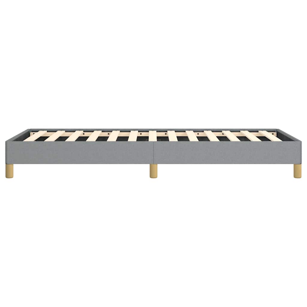 Gray upholstered twin bed frame with wooden slats and round legs