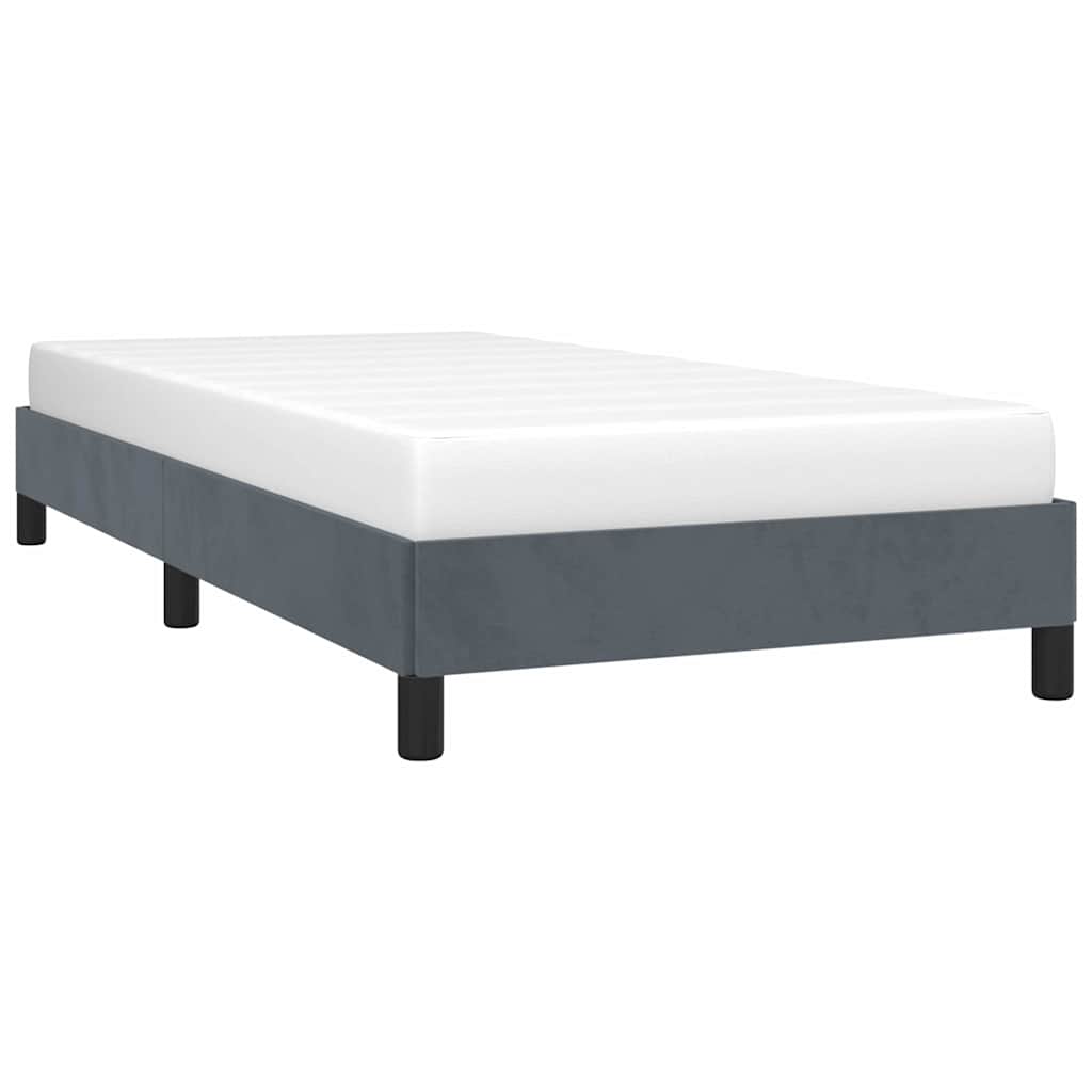 Gray upholstered twin bed frame with white mattress
