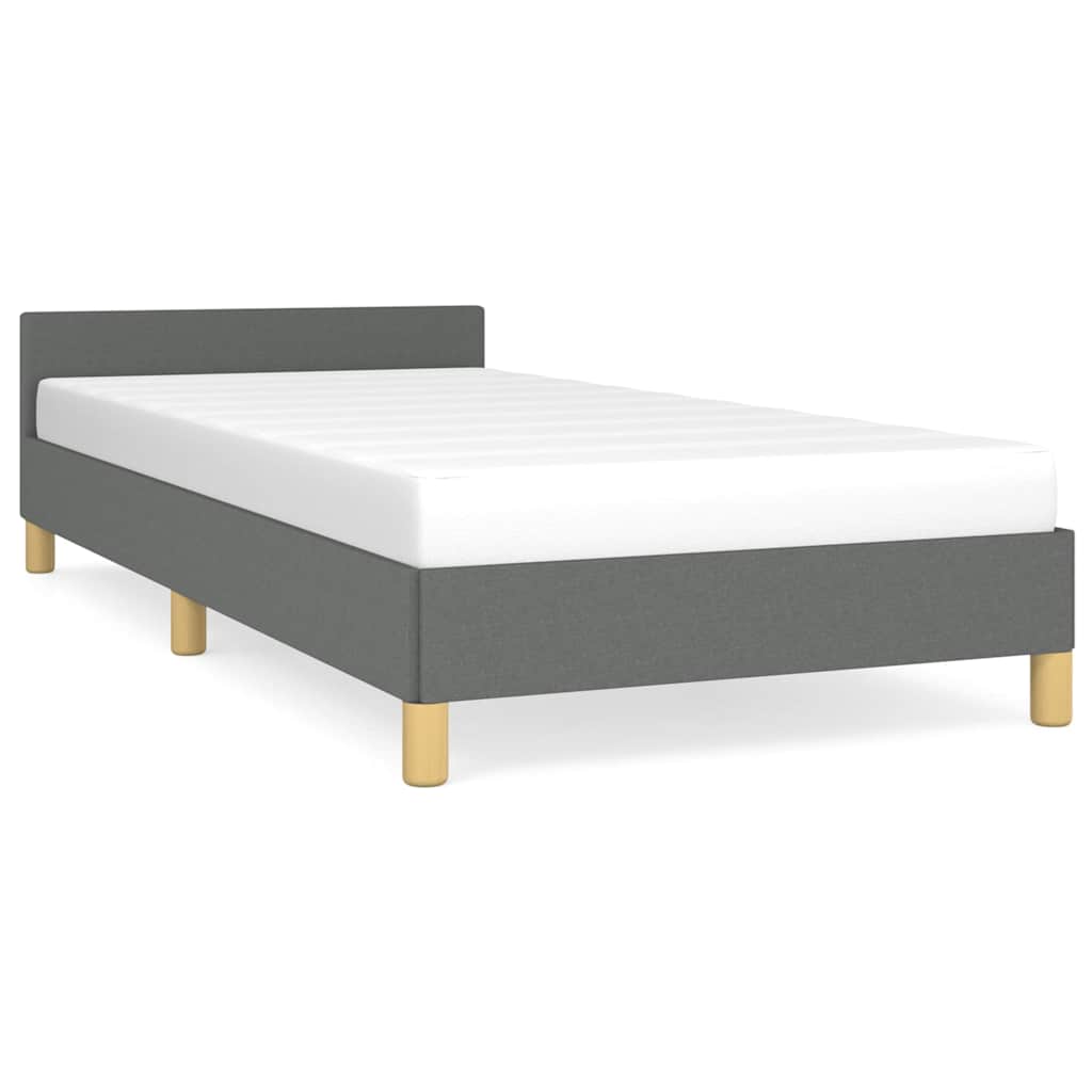 Line drawing of a white upholstered bed frame with dimensions indicated