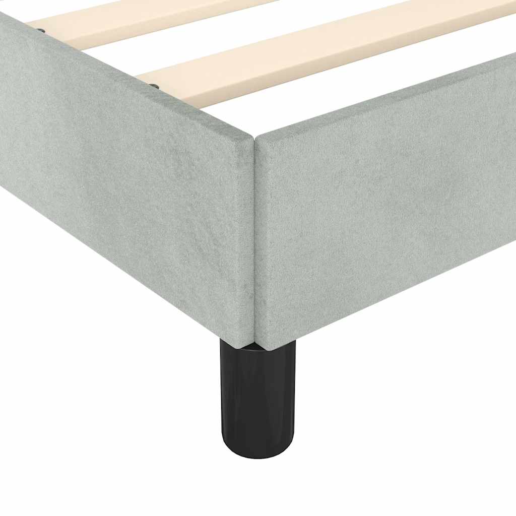 Light blue velvet upholstered bed frame with slatted base