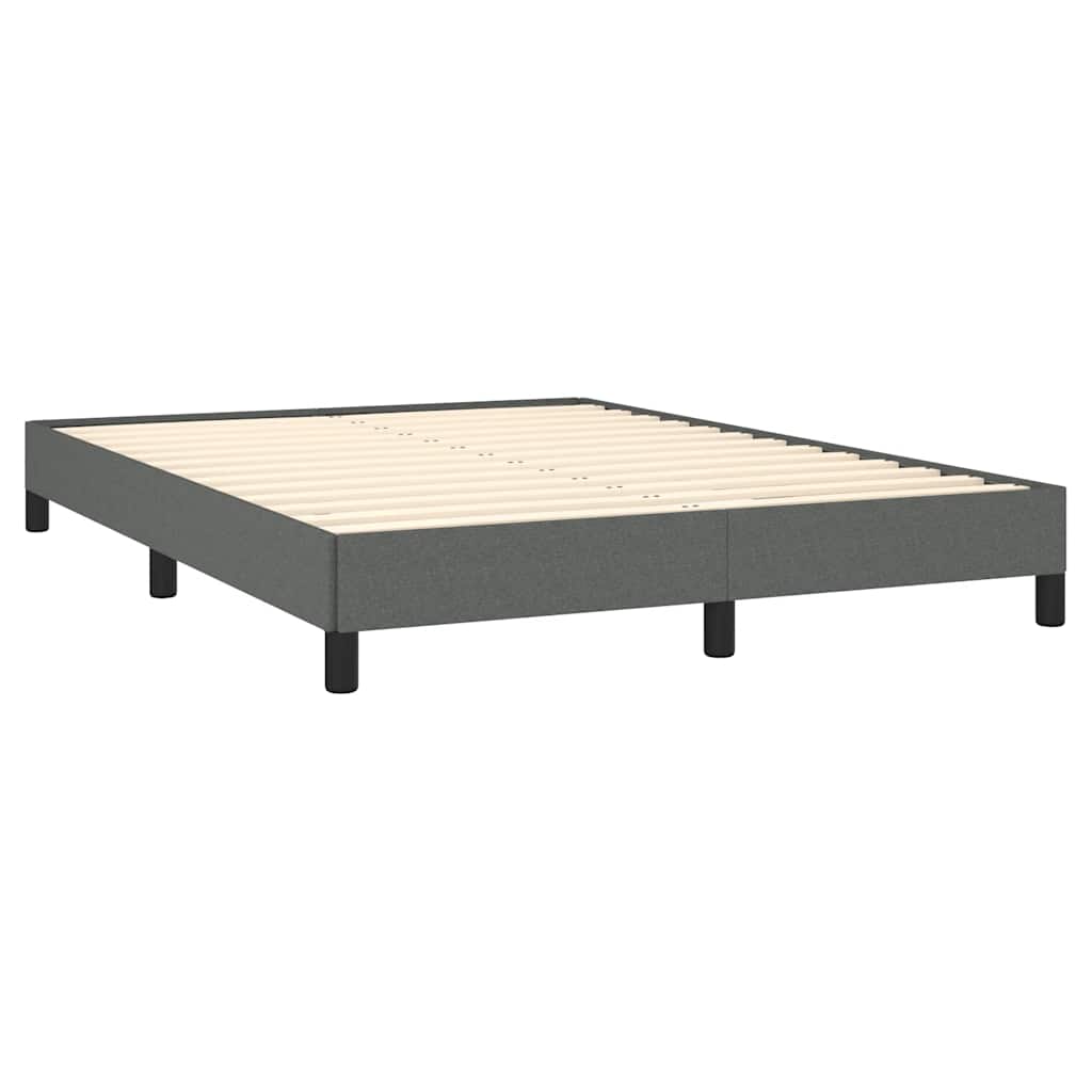 Modern grey upholstered bed frame with white mattress and black legs