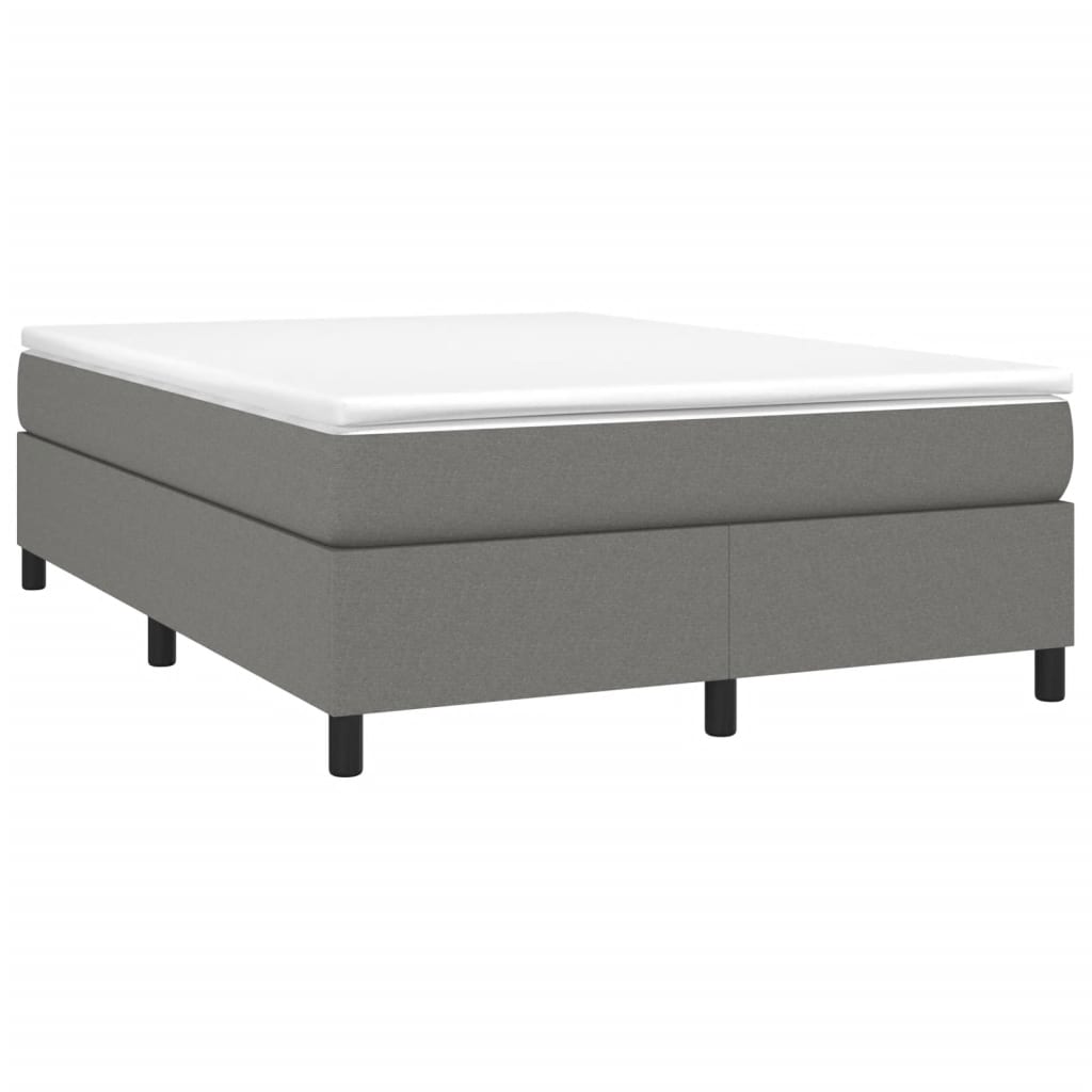 Gray upholstered divan bed with a white mattress and black legs