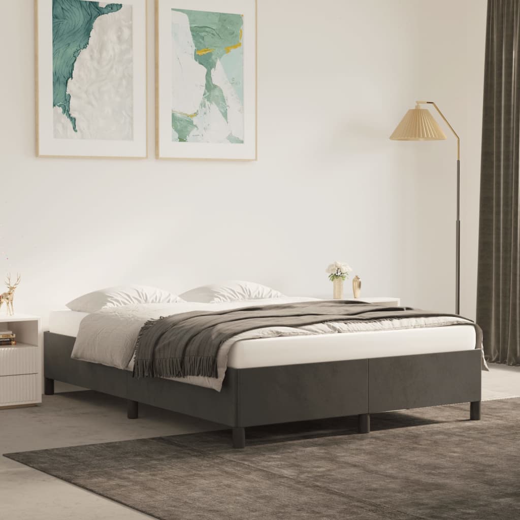 Gray upholstered queen bed frame with minimalist design featuring clean lines and sturdy wooden legs for a modern bedroom