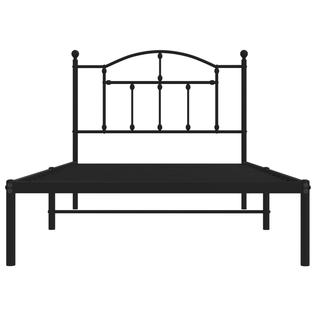 Black metal twin bed frame with arched headboard and decorative finials