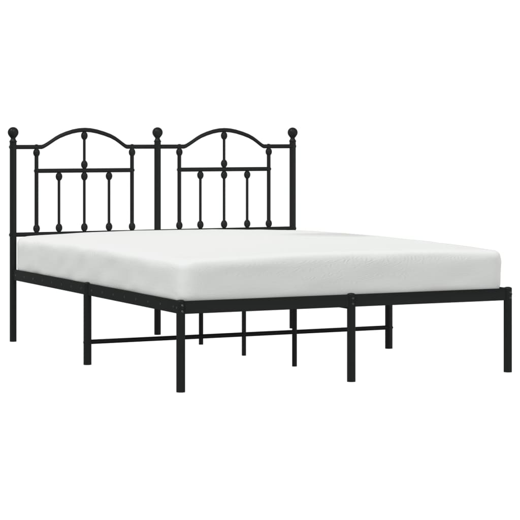 Black metal bed frame with a decorative arched headboard