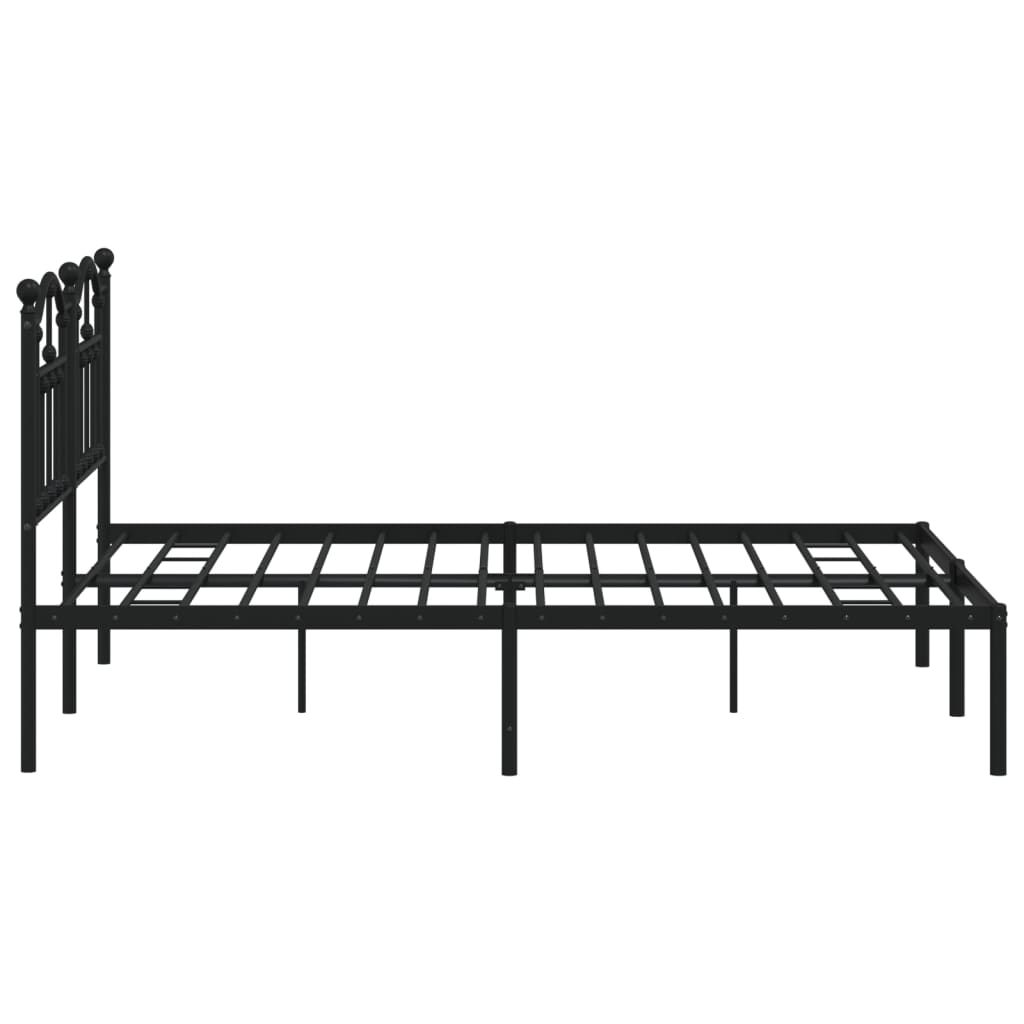 Black metal bed frame with a curved spindle headboard and a white mattress