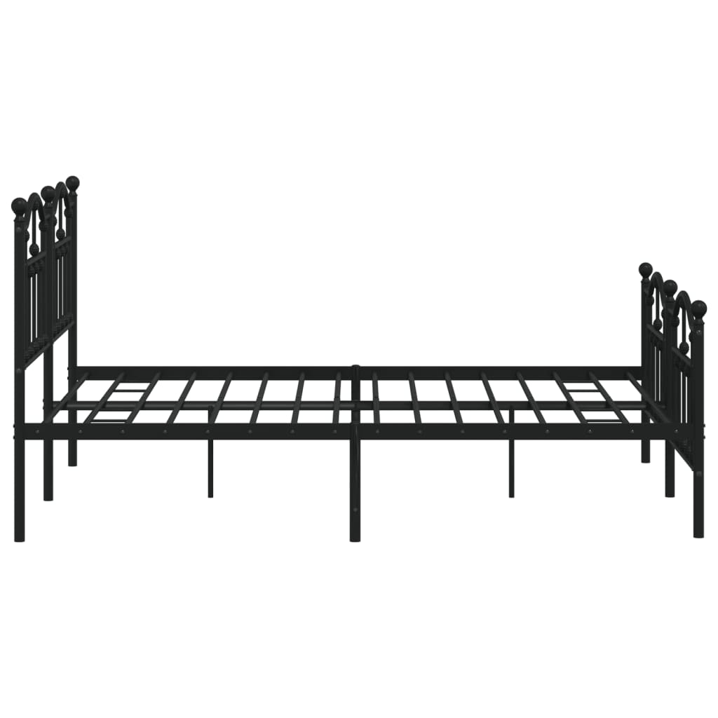 Black metal bed frame with a white mattress and ornate headboard and footboard