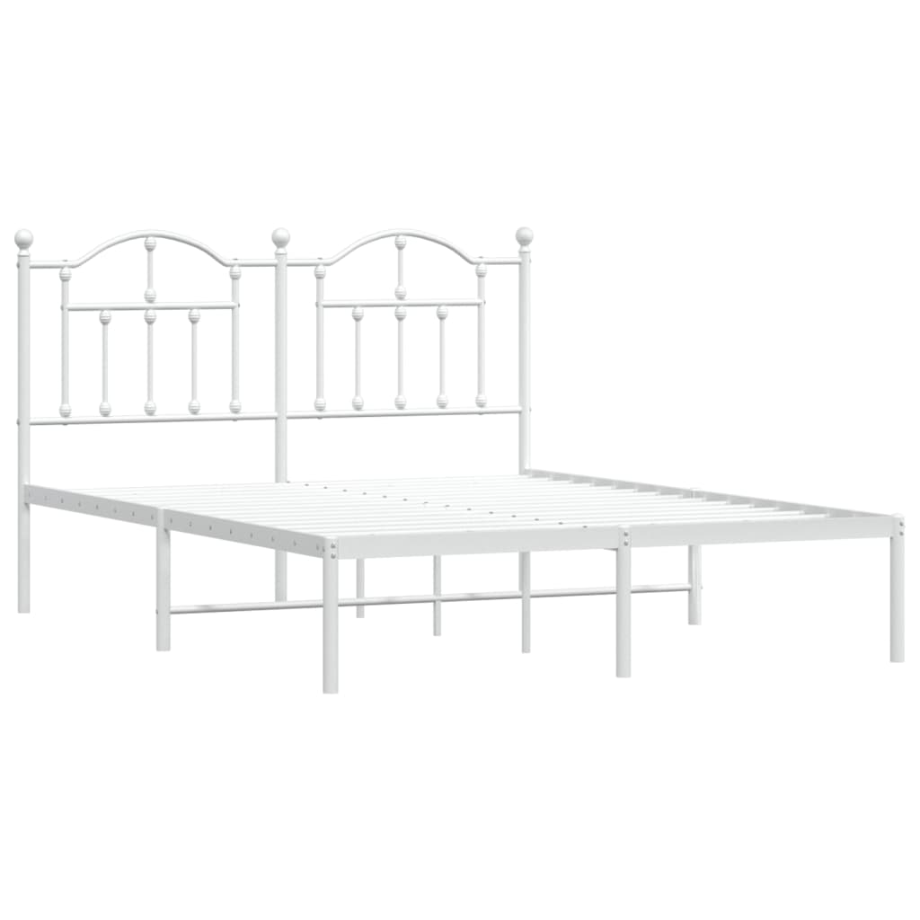 White metal bed frame with decorative arched headboard and mattress