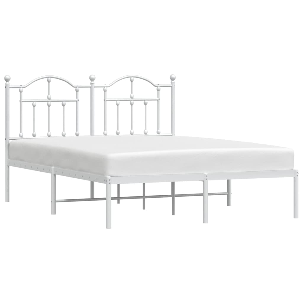 White metal bed frame with ornate headboard