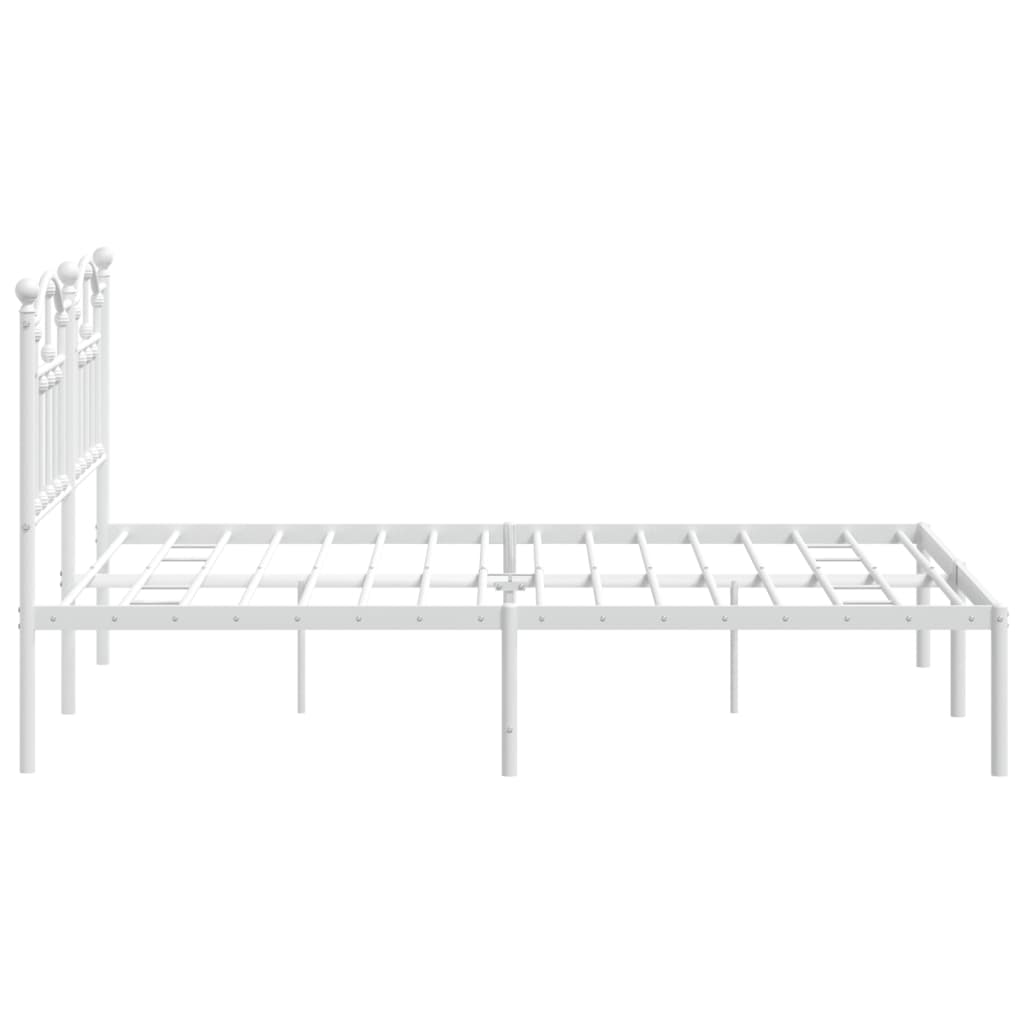 White metal bed frame with ornate headboard and mattress