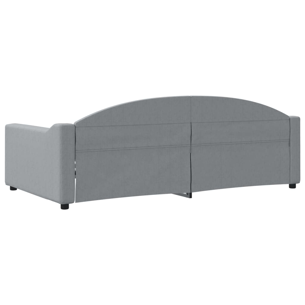 Grey upholstered loveseat with button tufting on the backrest