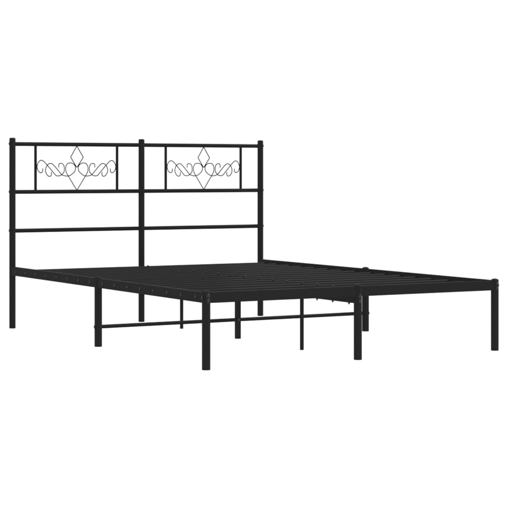 Black metal bed frame with a decorative headboard and white mattress