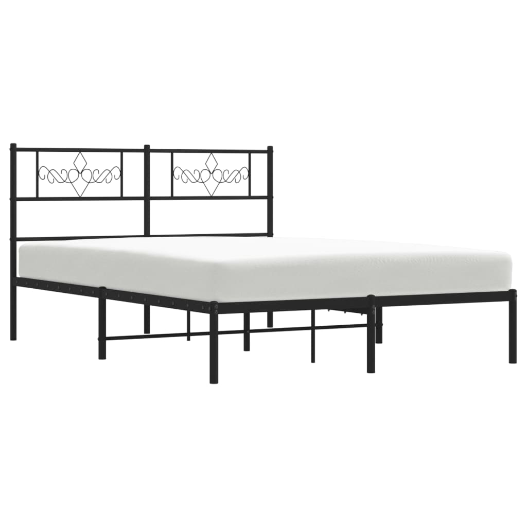 Black metal bed frame with ornate scrollwork headboard