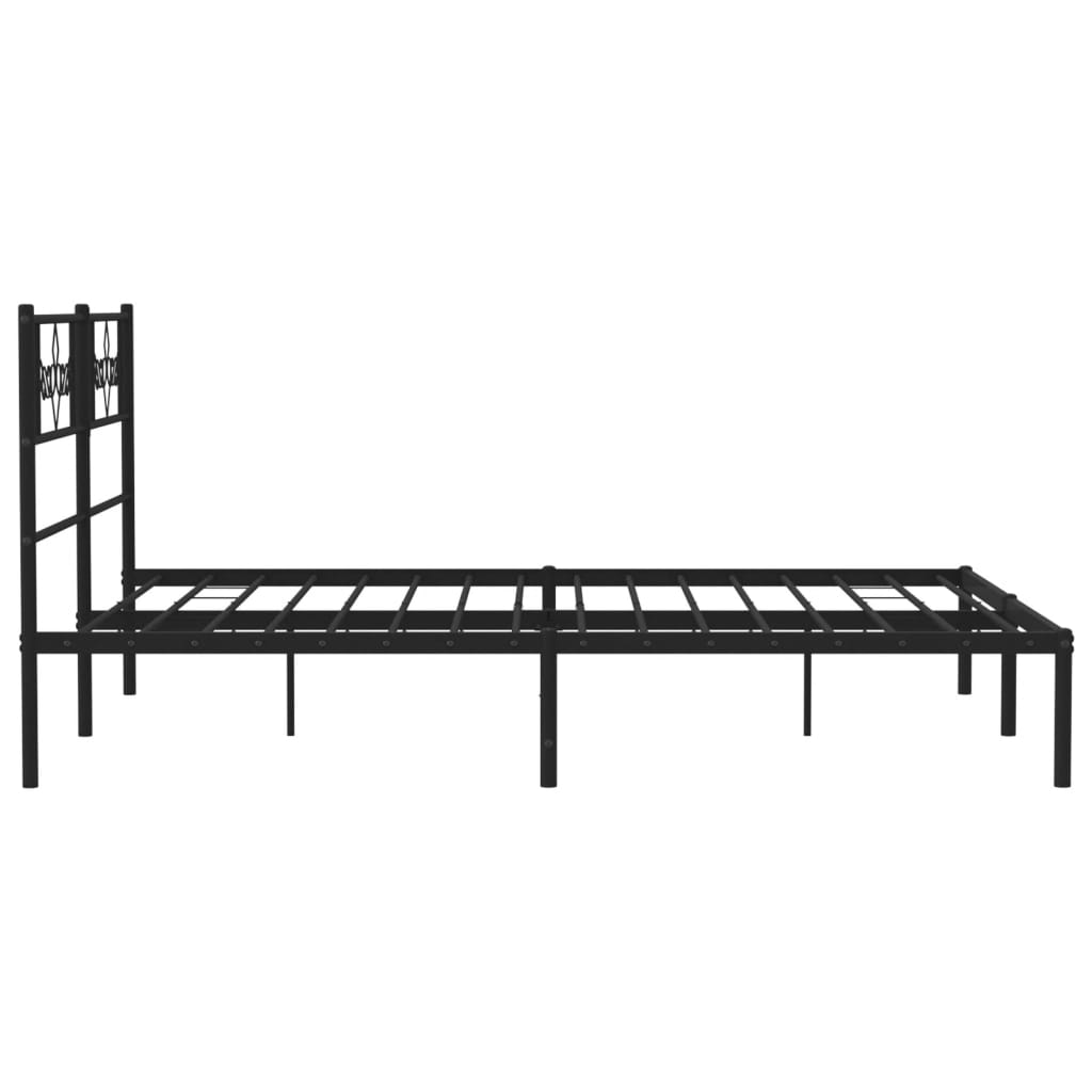 Black metal bed frame with ornate headboard and white mattress