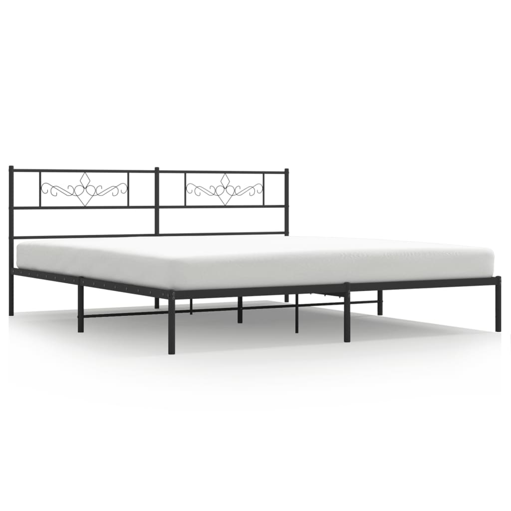 White metal bed frame with ornate headboard and mattress support slats