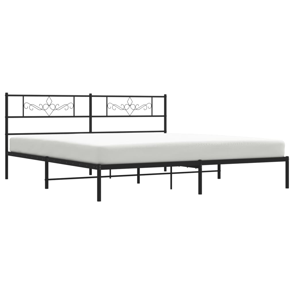 Black metal bed frame with ornate headboard detail