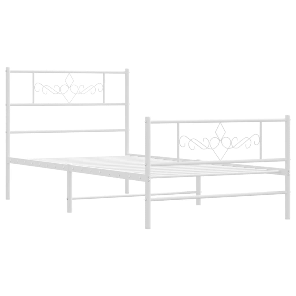White metal twin bed frame with ornate scrollwork headboard and footboard