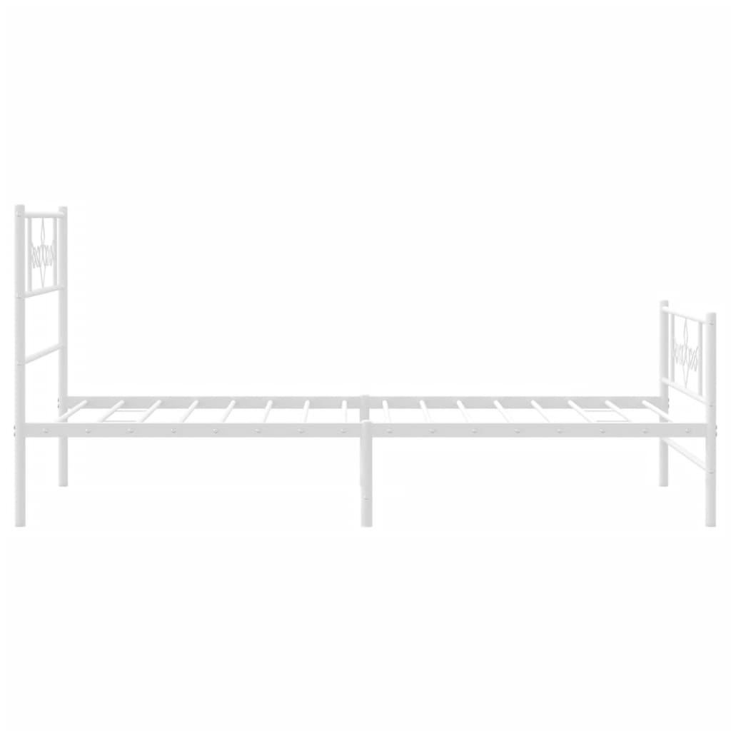 White metal bed frame with decorative scrollwork on headboard and footboard