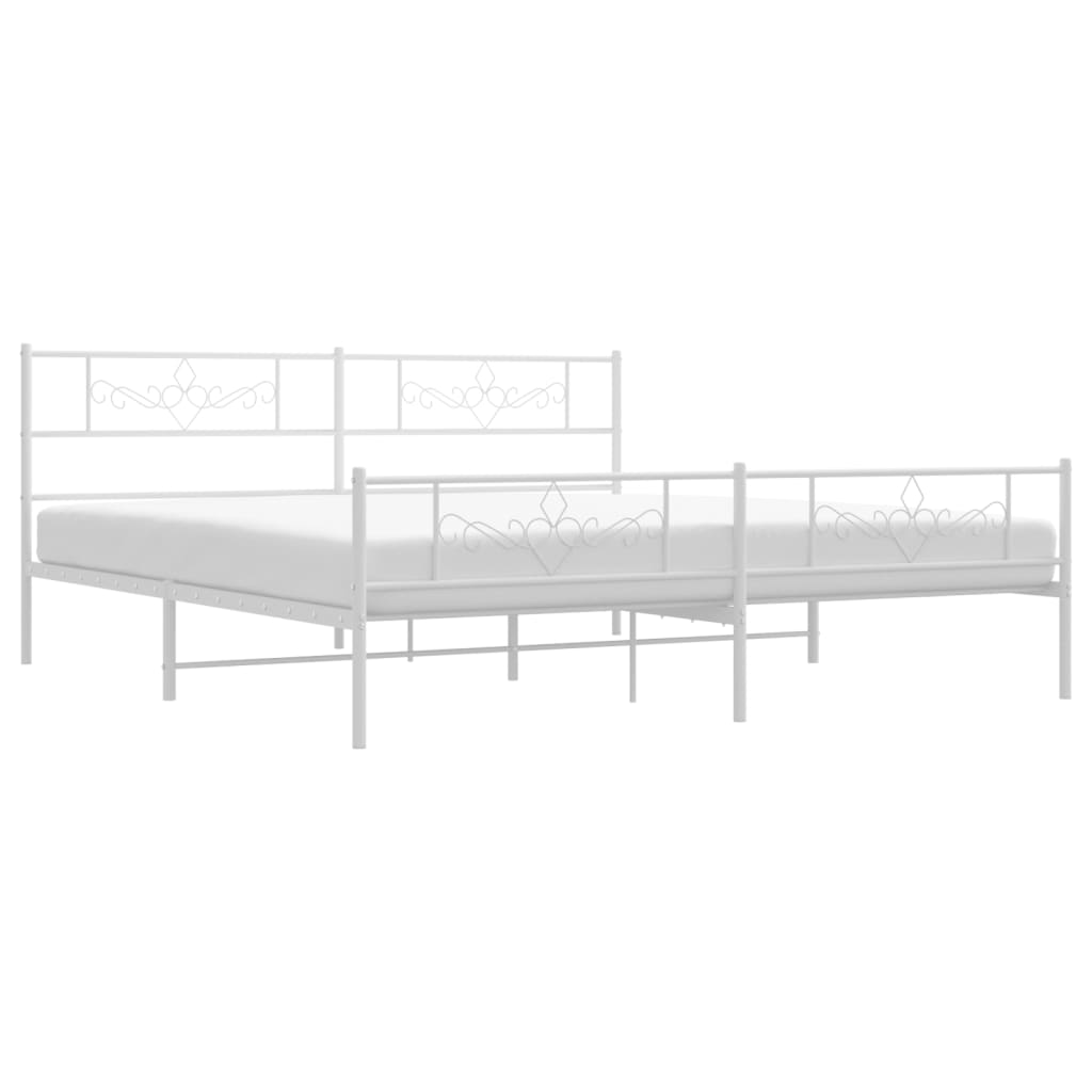 White metal bed frame with ornate scrollwork on headboard and footboard