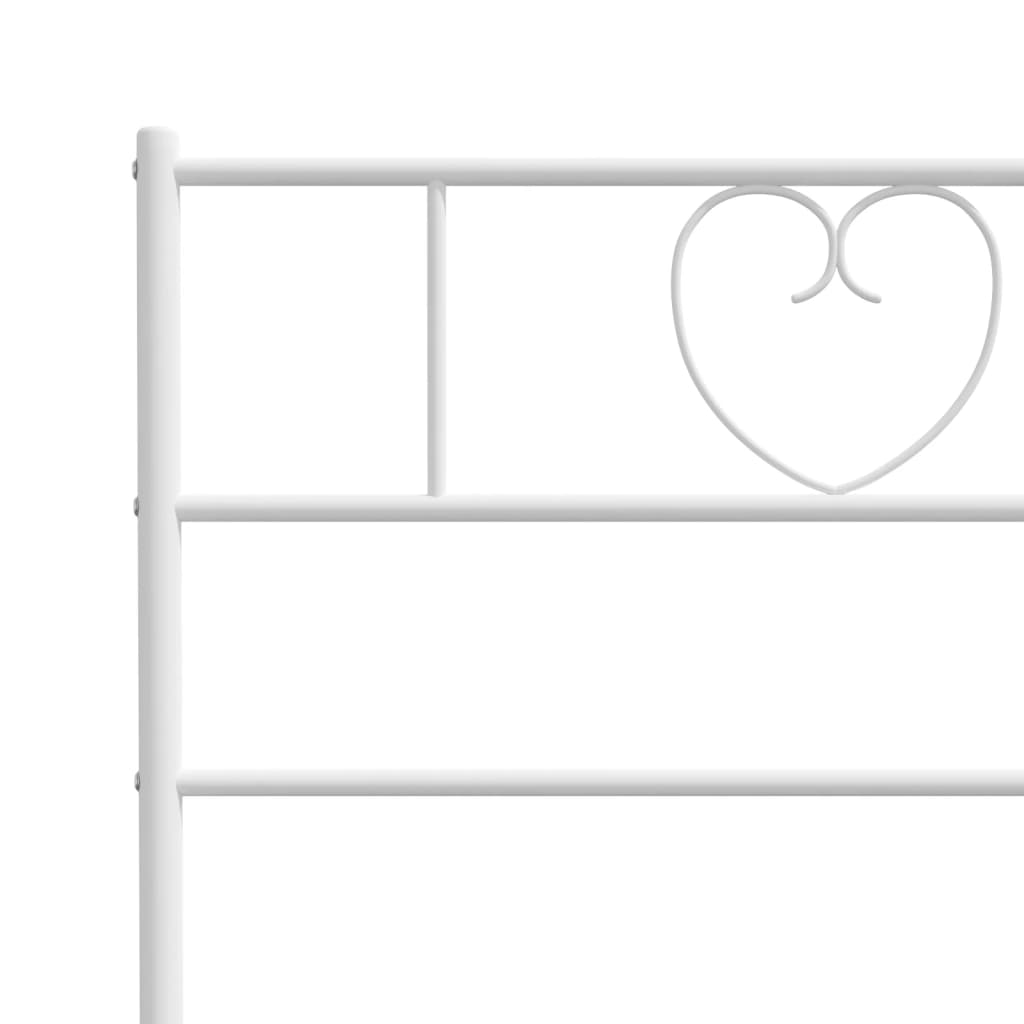 White metal bed frame with heartshaped headboard detail