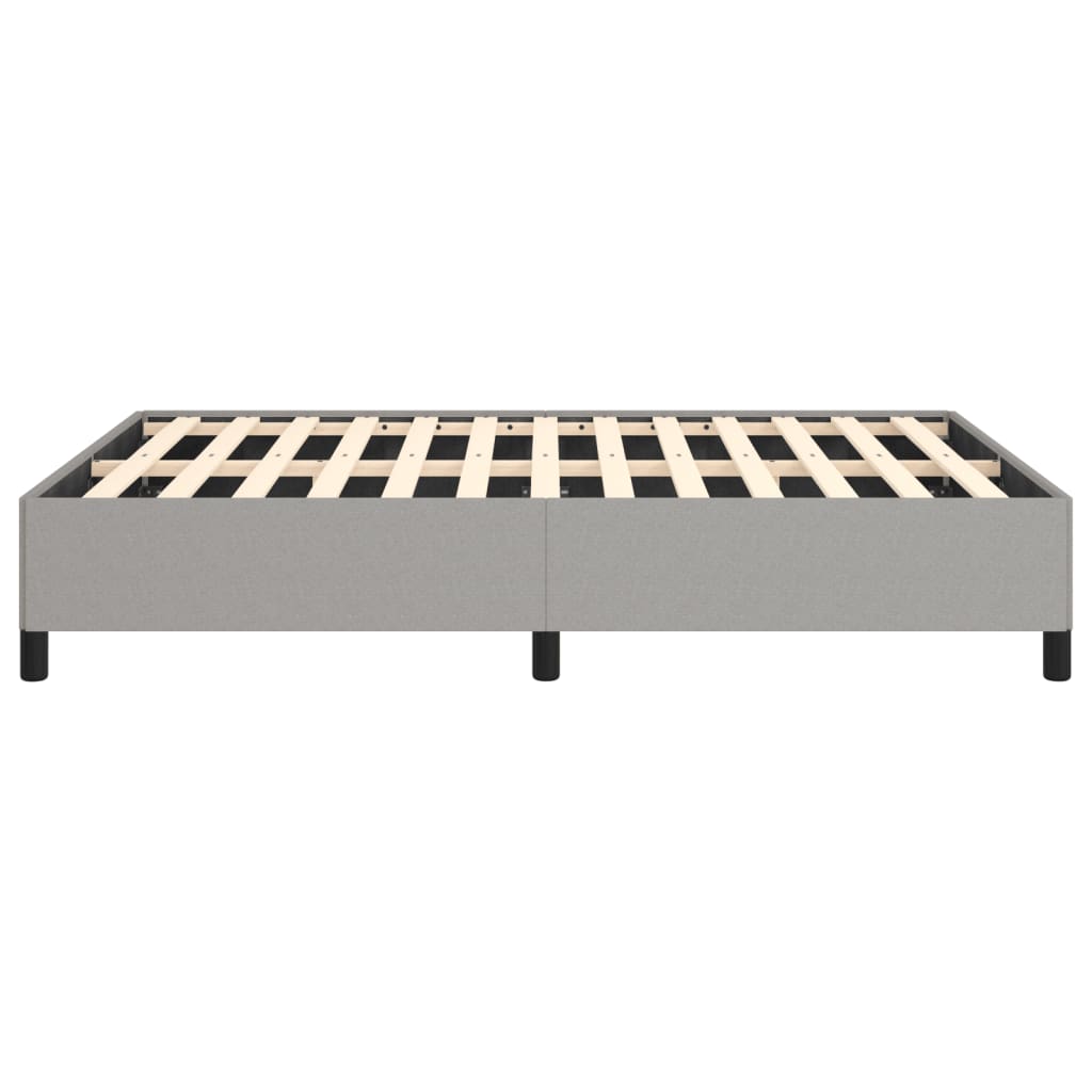 Grey upholstered platform bed frame with wooden slats