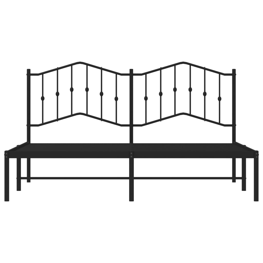 Black metal bed frame with ornate headboard and white mattress