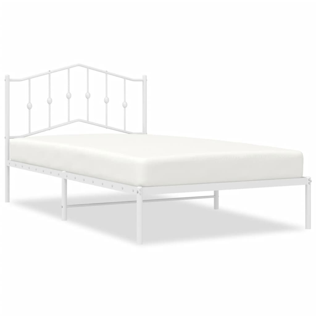 White metal bed frame with ornamental headboard and slatted base