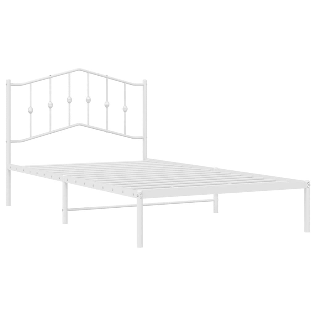 White metal twin bed frame with decorative headboard and footboard