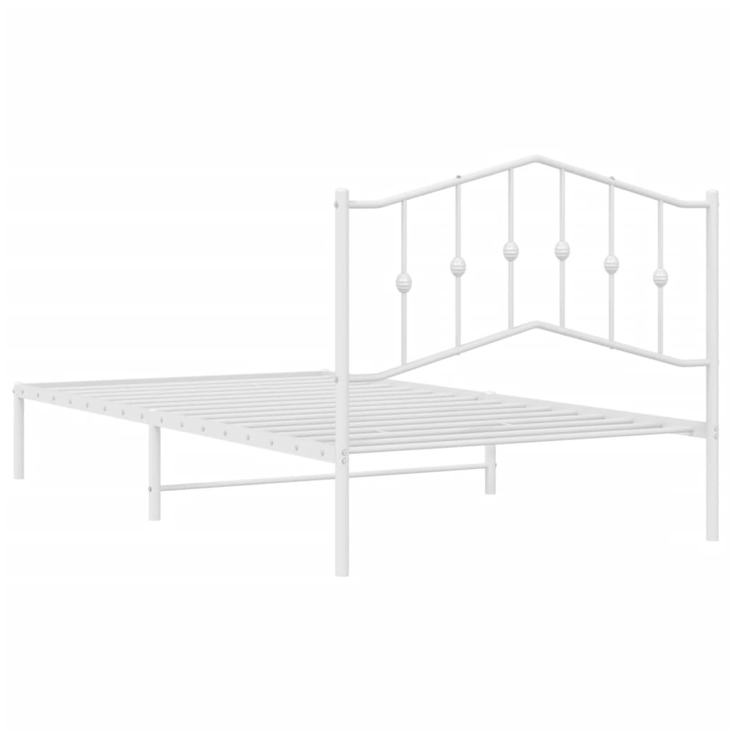White metal twin bed frame with decorative spherical accents on the headboard
