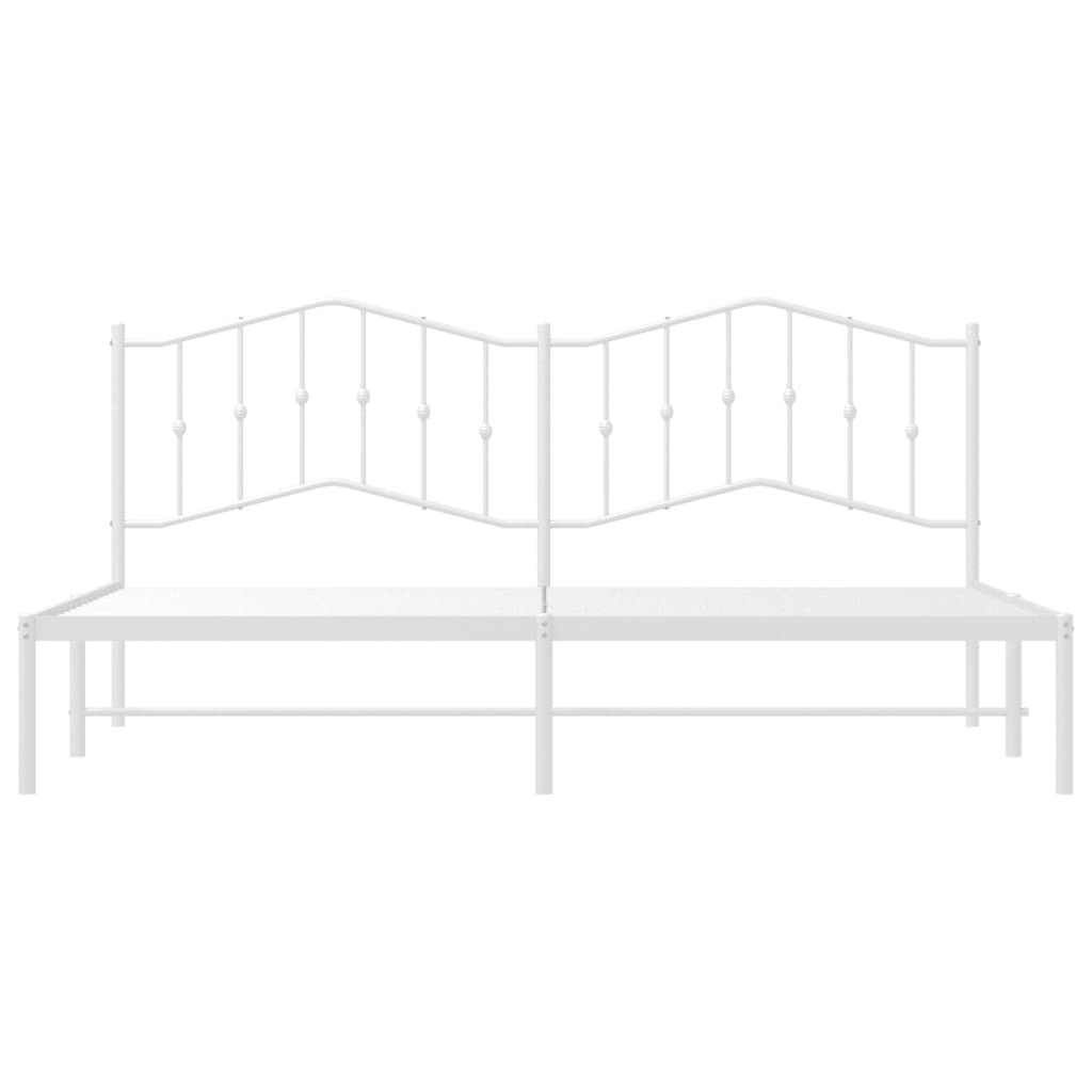White metal bed frame with ornate headboard and included mattress
