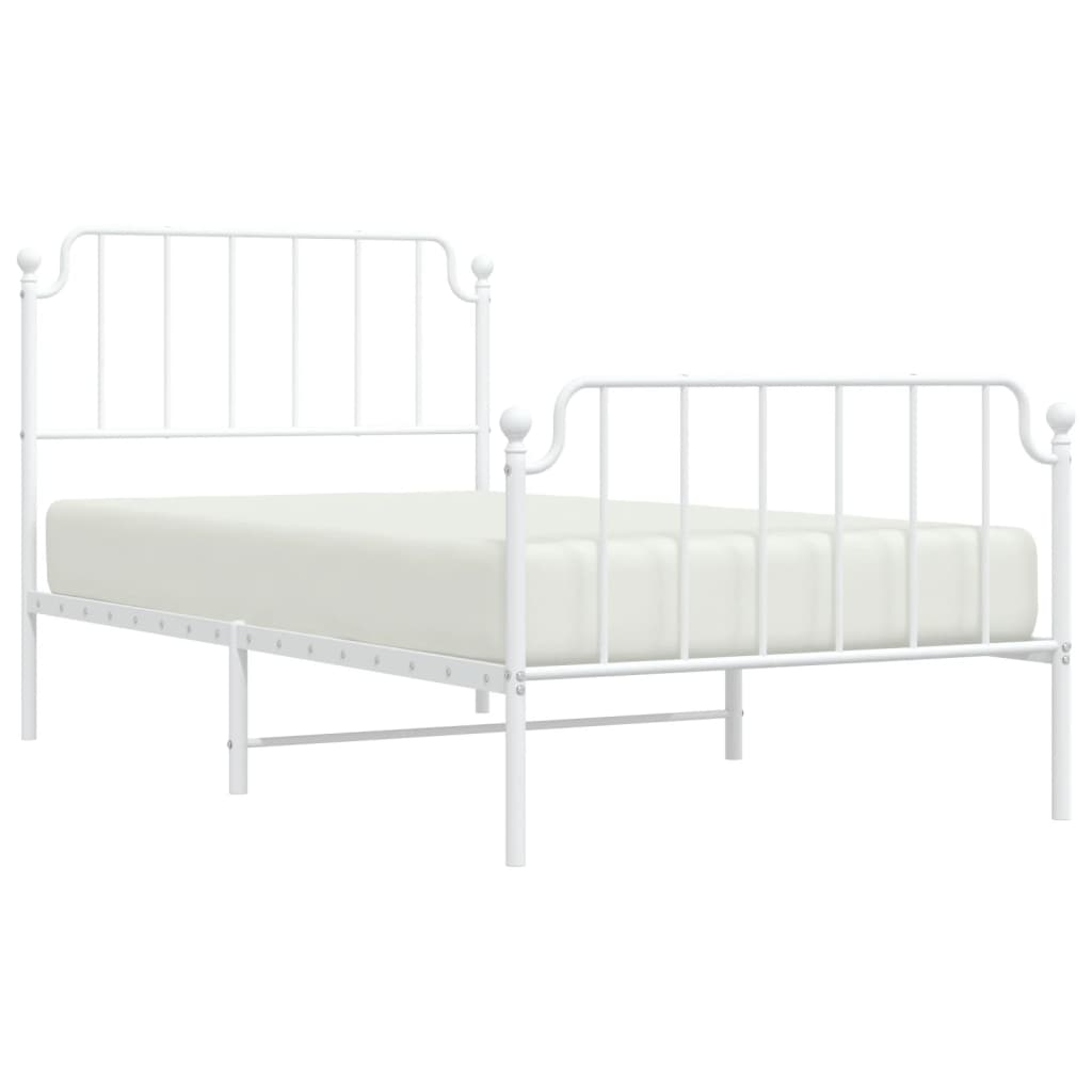 White metal single bed frame with rounded finials and mattress