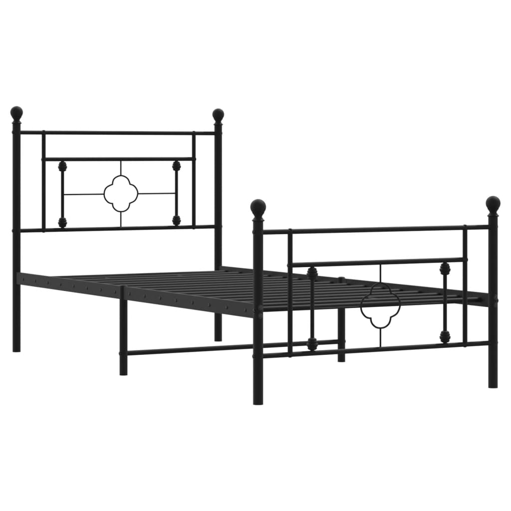 Black metal bed frame with decorative finials and patterned bedding