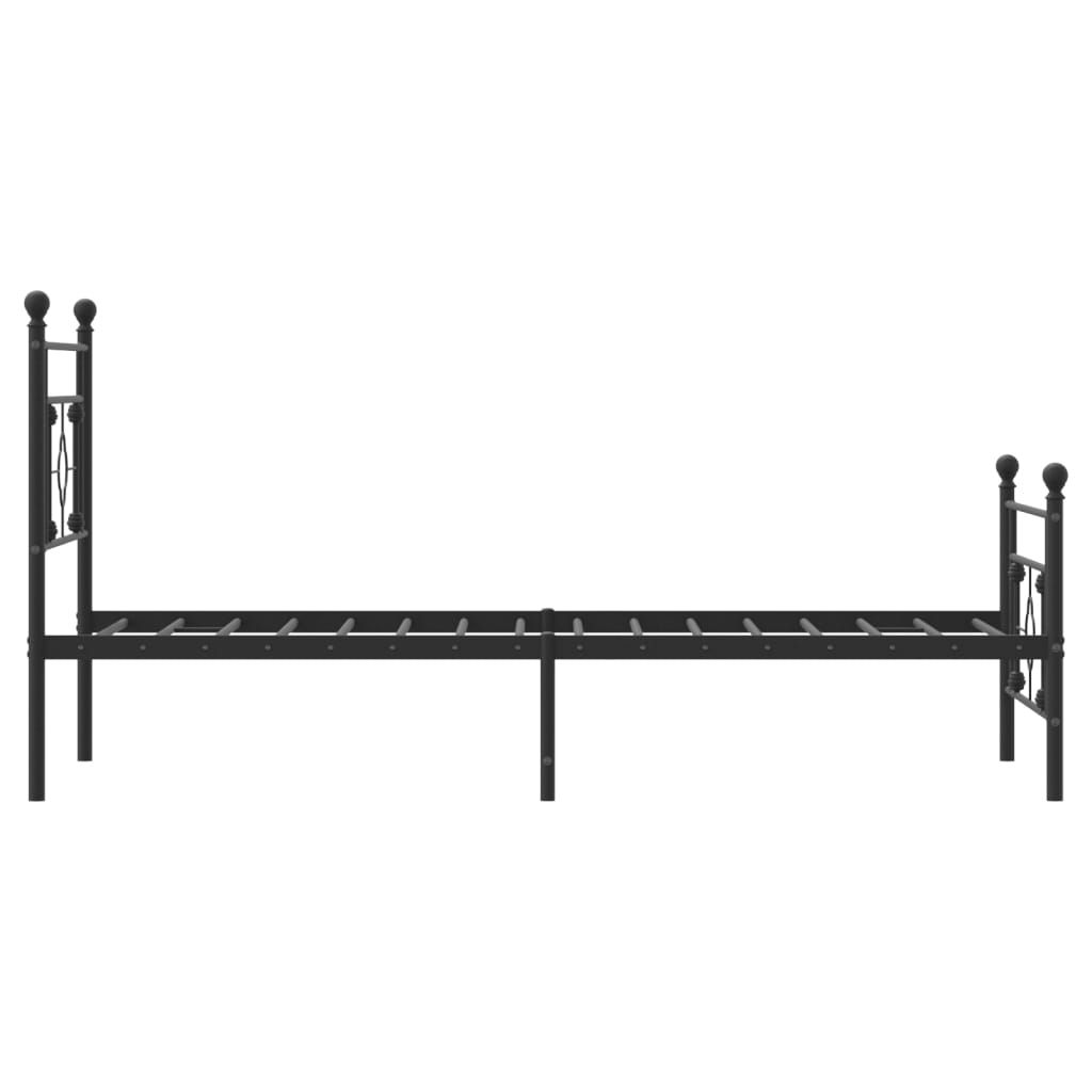 Black metal twin bed frame with decorative finials and patterned bedding