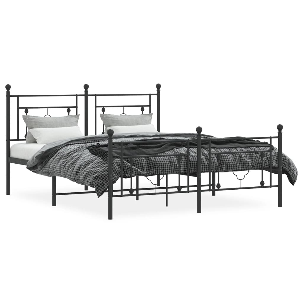Black metal bed frame with decorative quatrefoil accents and a white mattress