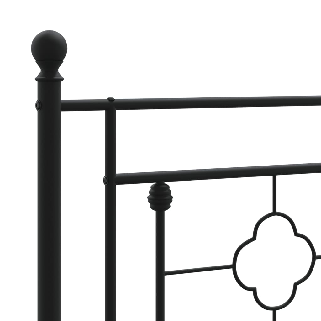 Black metal bed frame with ornate headboard and footboard