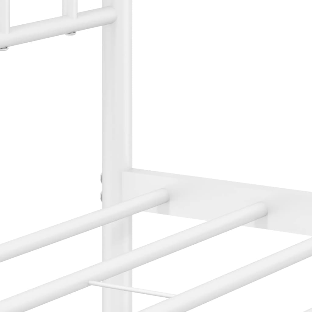 White metal bed frame detail with decorative finial and clovershaped inlay
