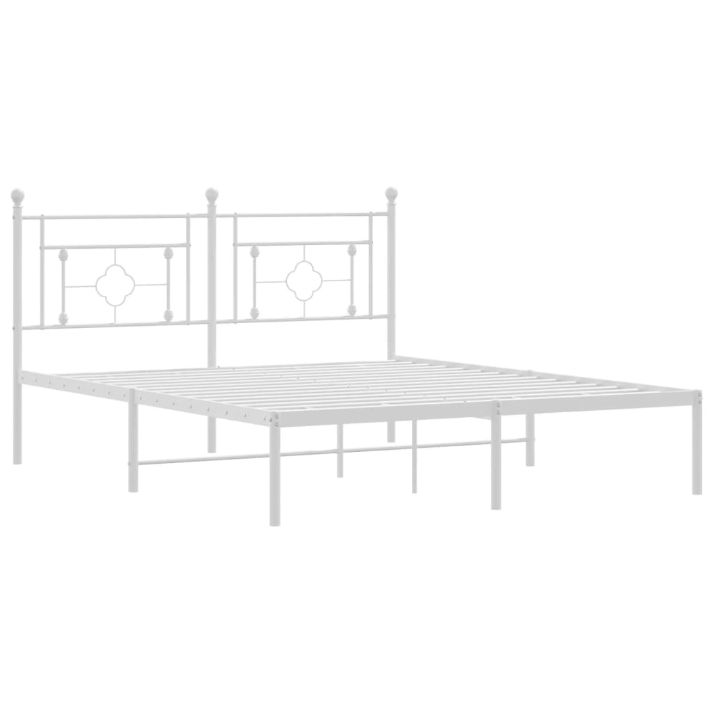 White metal twin bed frame with ornate headboard and footboard