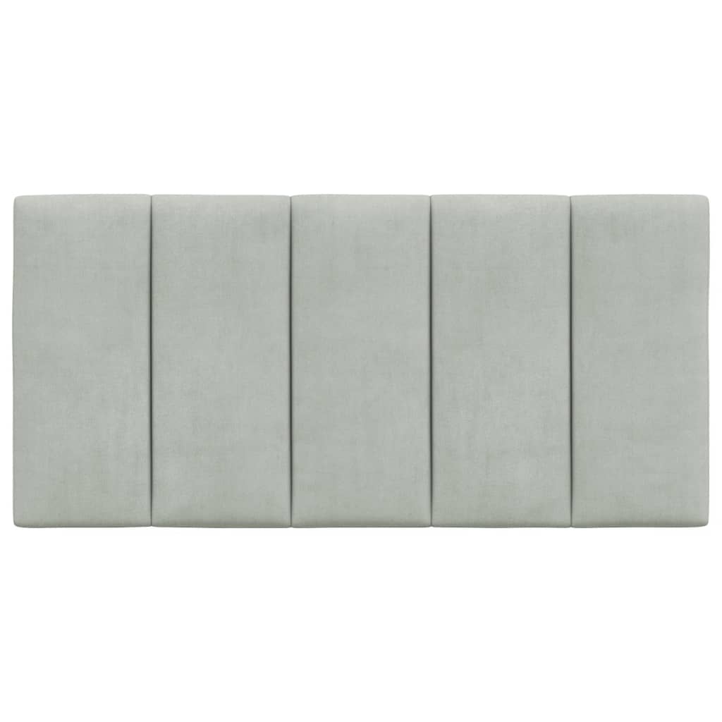 Sage green upholstered headboard with vertical panels