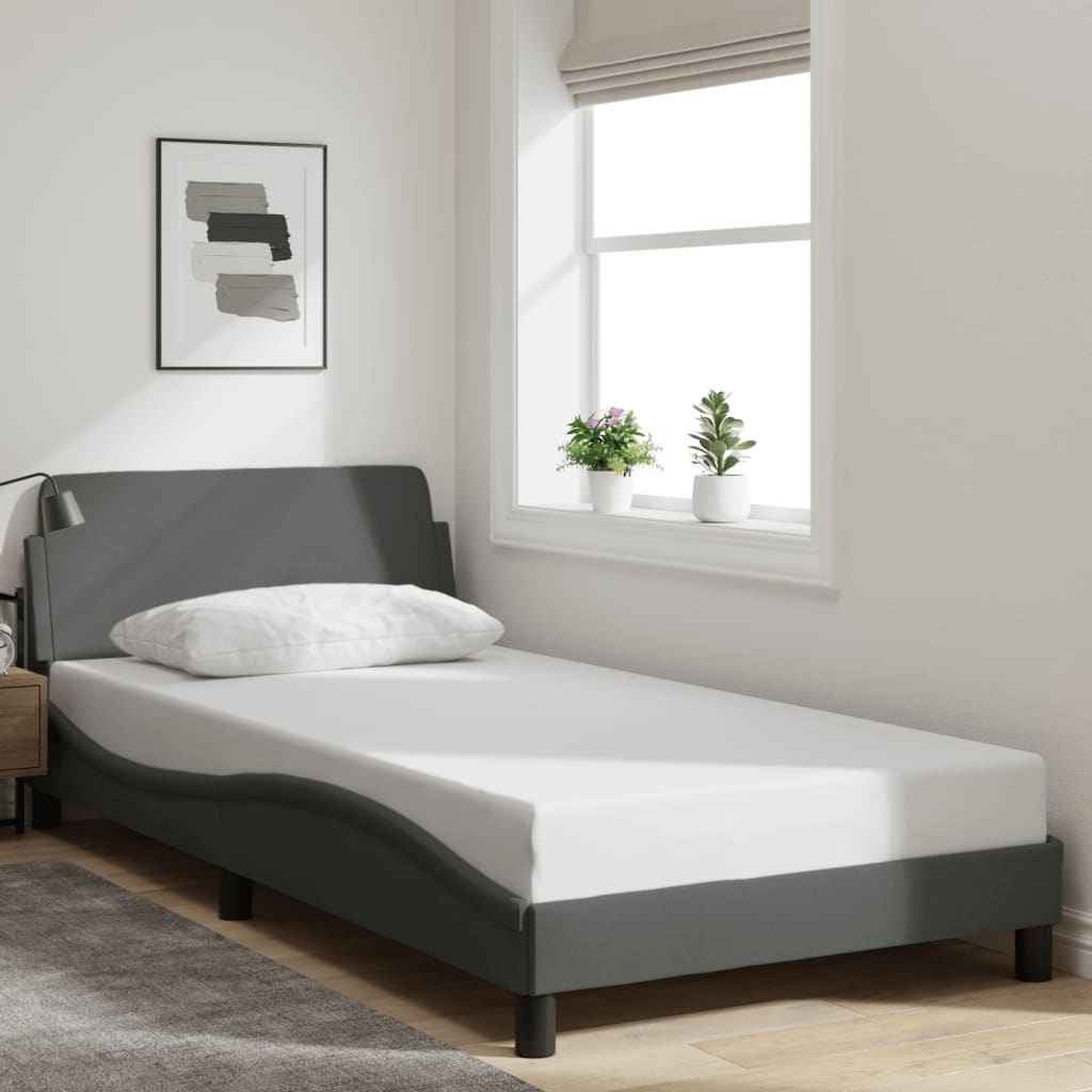 Single size memory foam mattress with upholstered grey bed frame