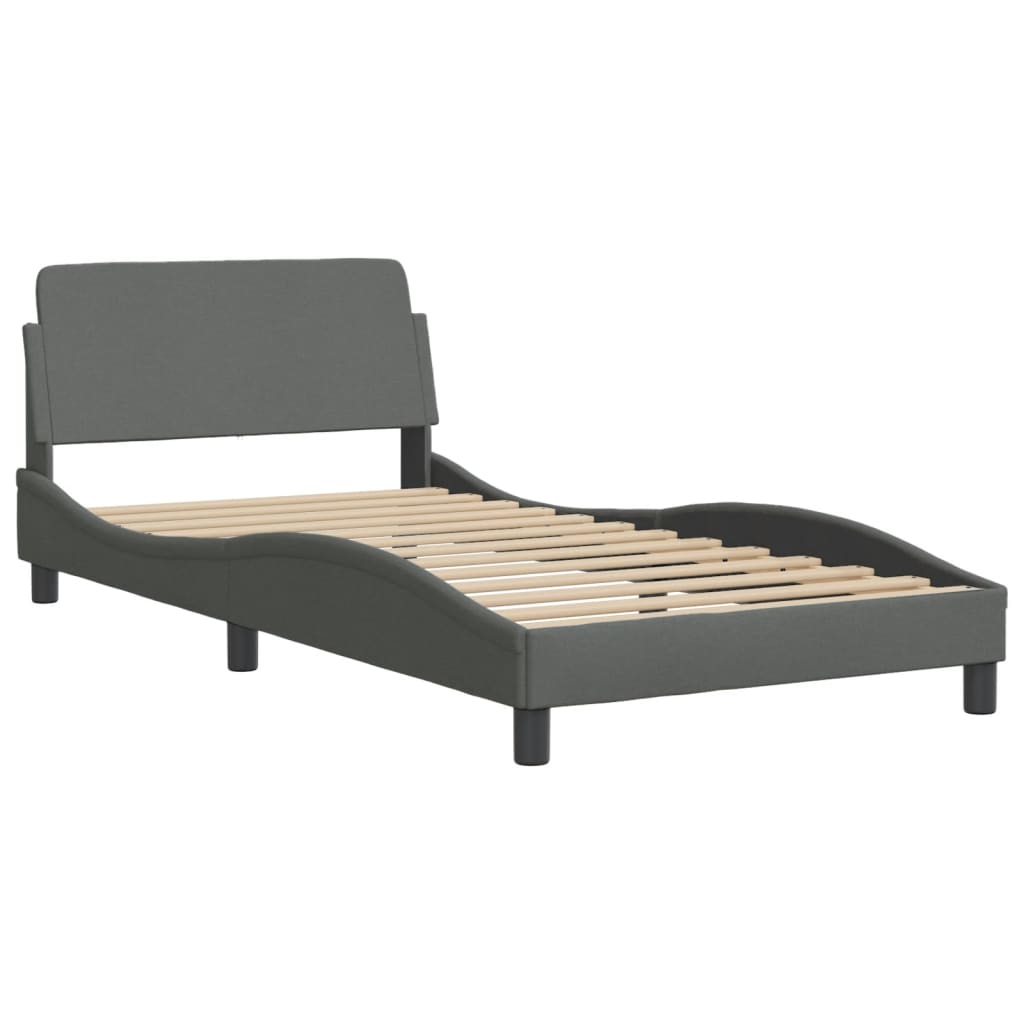 Dark grey upholstered single bed frame with white mattress
