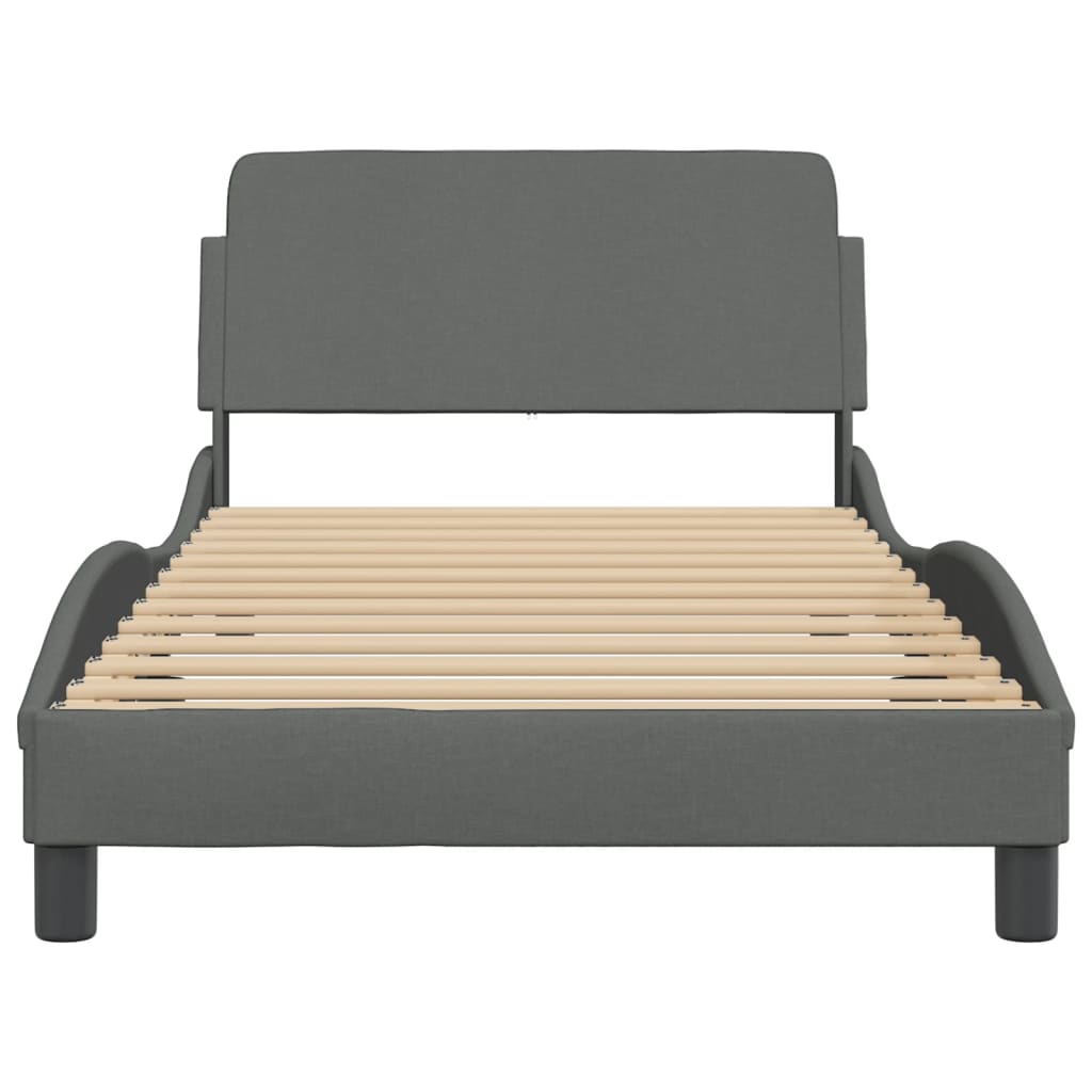 Modern gray upholstered twin bed frame with curved design and wooden slats
