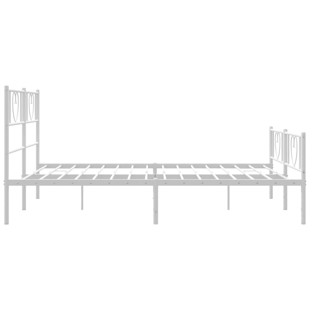 White metal twin bed frame with heart detailing on headboard and footboard