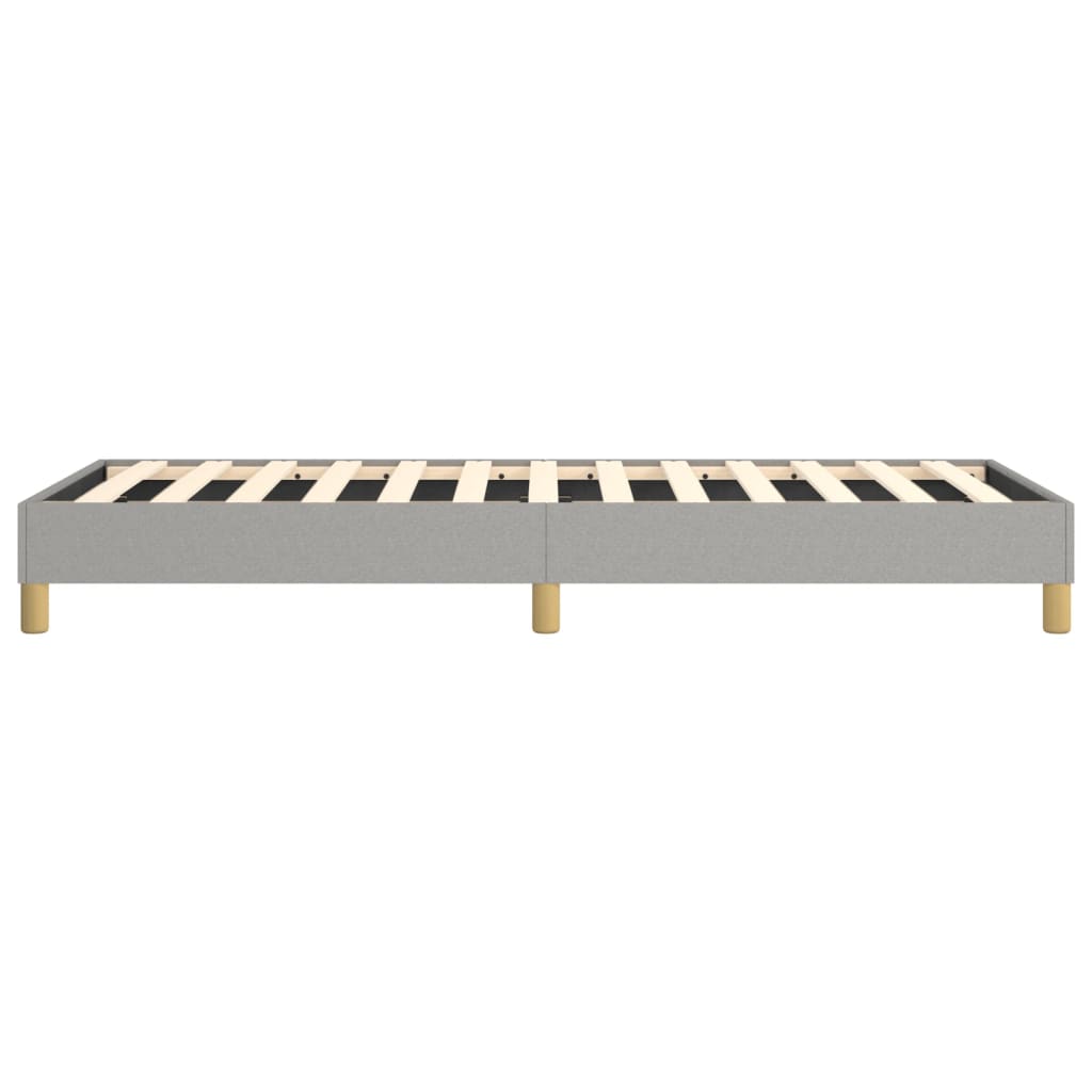 Modern grey fabric upholstered bed frame with wooden slats and tapered legs