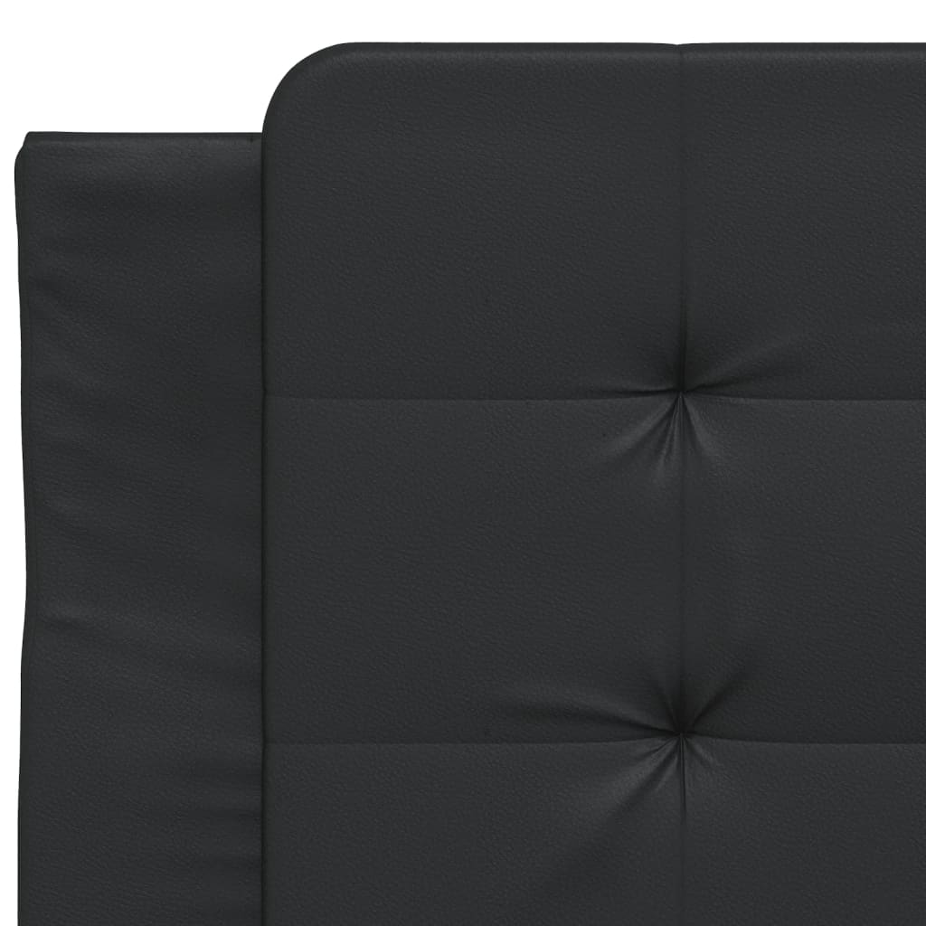 Black upholstered bed frame corner with a black cylindrical leg