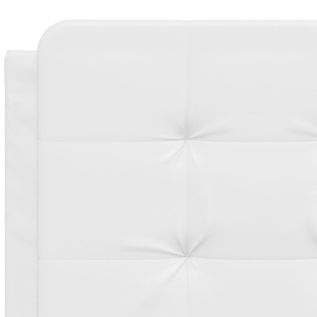 White upholstered bed frame corner with black cylindrical legs