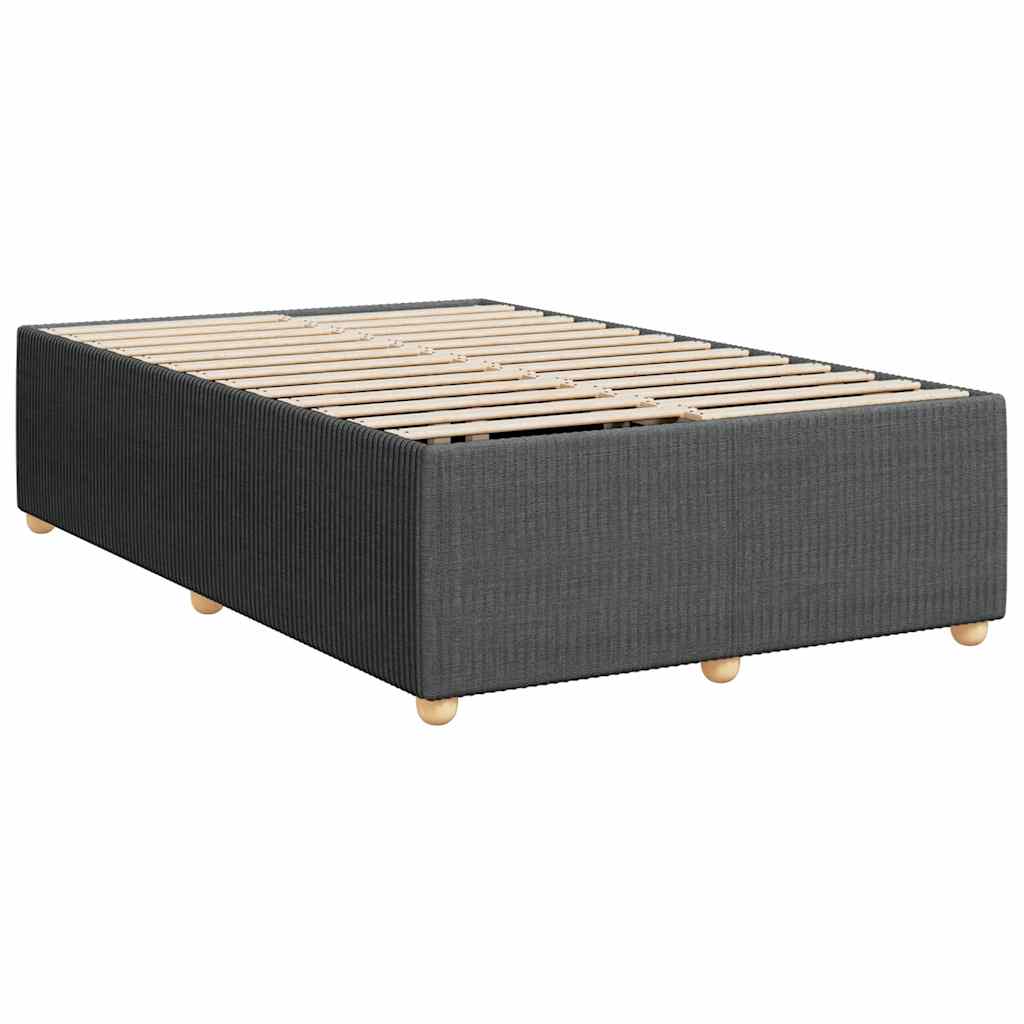 Grey divan bed base with white bedding and mattress