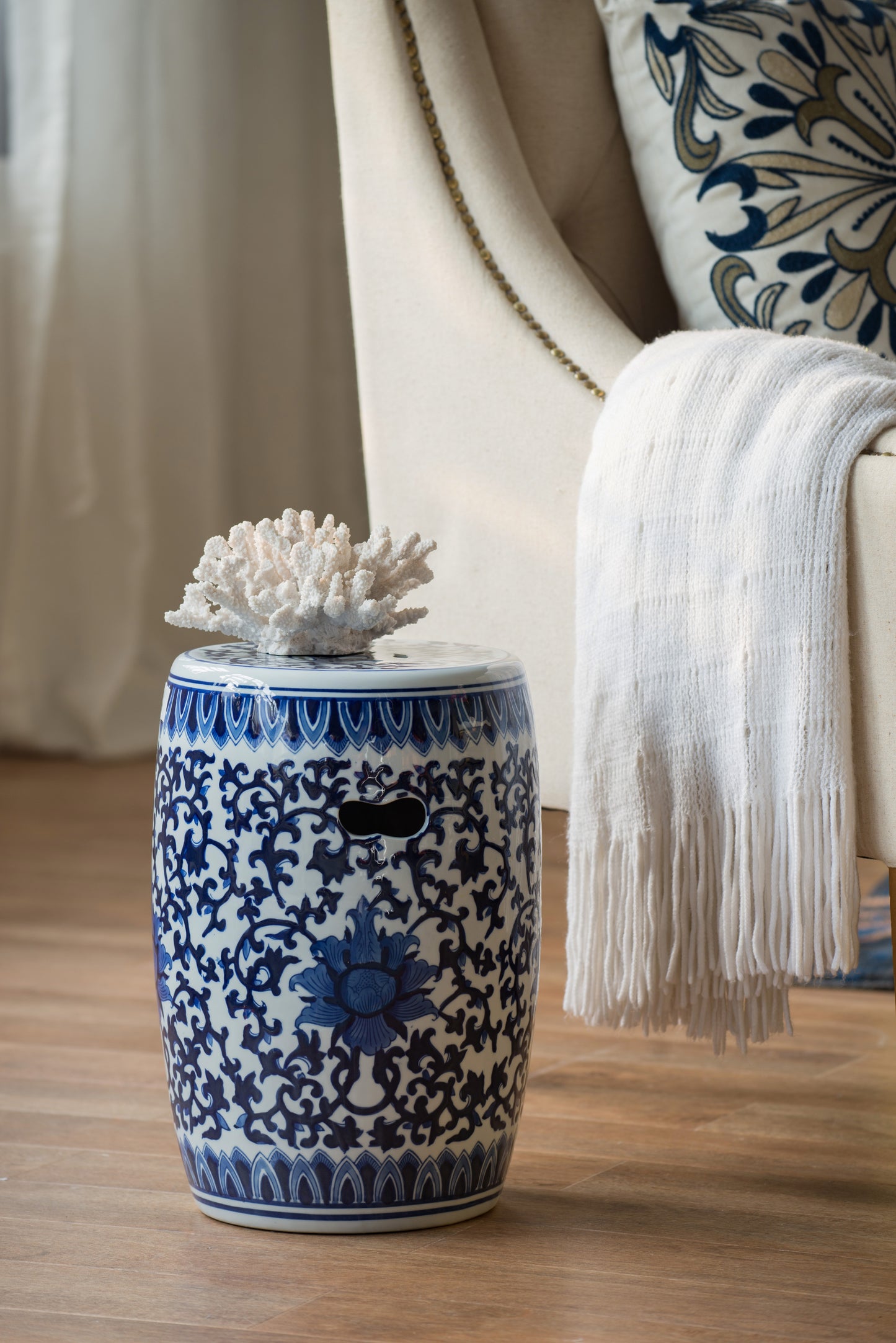 Blue and white ceramic garden stool with floral motif
