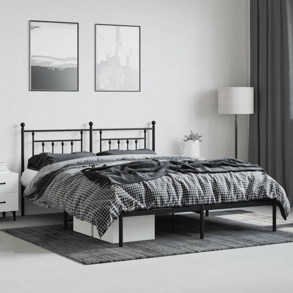 Black metal bed frame with ornate headboard