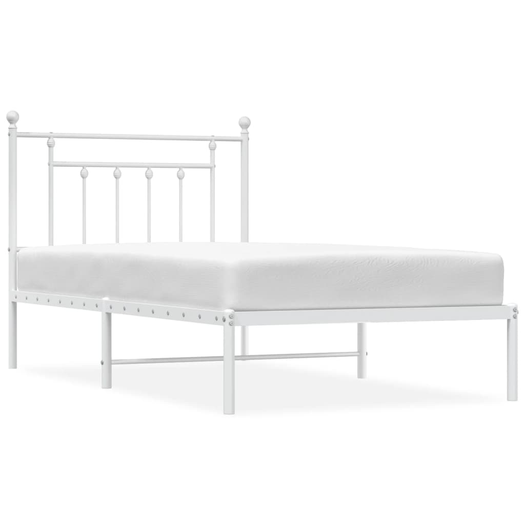 Metal bed frame in white with ornamental finials and slatted base showing dimensions